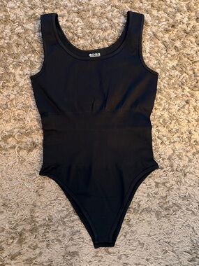 OQQ Black Sleeveless One-Piece Bodysuit